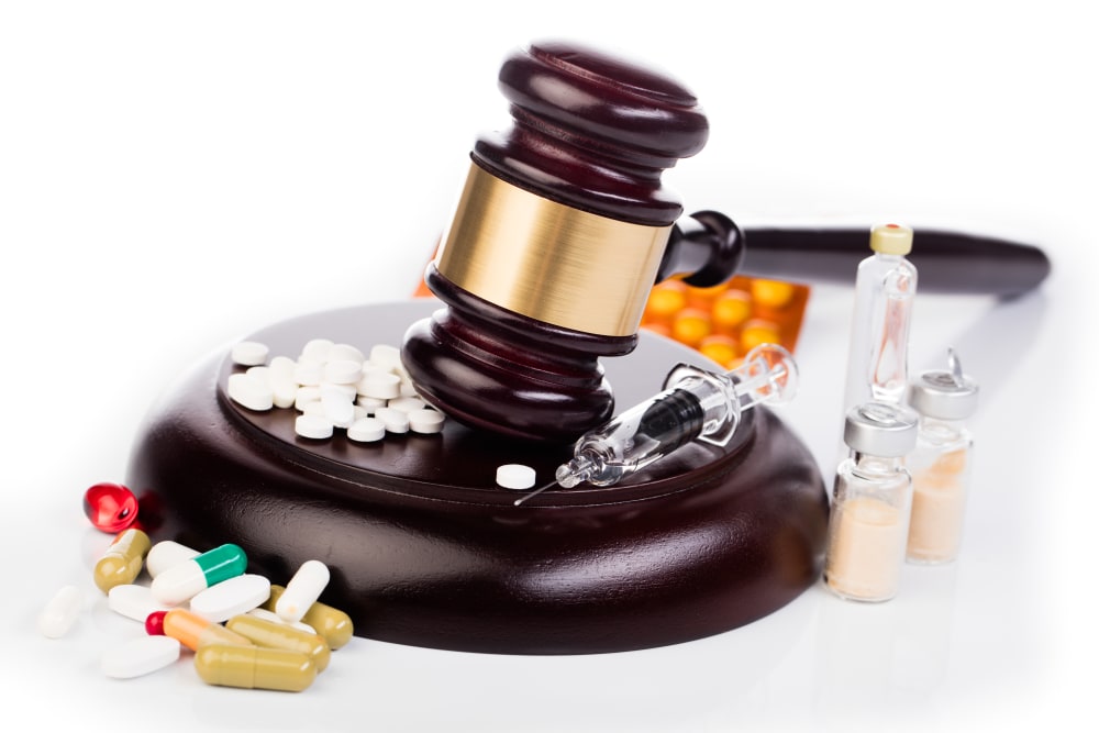 law gavel medicines and drugs isolated on white