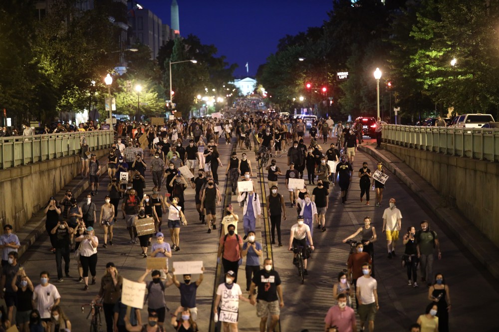 WASHINGTON, DC - JUNE 03: Demonstrators march away from the White House during a peaceful protest against police brutality and the death of George Floyd, on June 3, 2020 in Washington, DC. Protests in cities throughout the country have been held after the death of George Floyd, a black man who was killed in police custody in Minneapolis on May 25.  (Photo by Win McNamee/Getty Images)