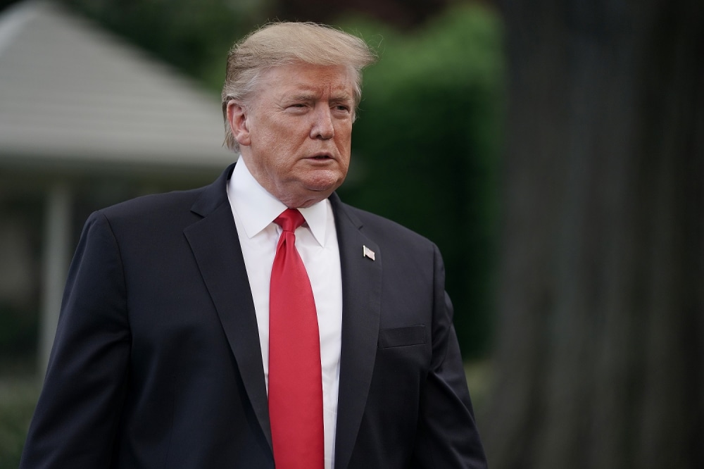 WASHINGTON, DC - MAY 20: U.S. President Donald Trump walks toward journalists as he departs the White House for a campaign rally in Pennsylvania May 20, 2019 in Washington, DC. On his way to Montoursville, Pennsylvania, Trump said that Iran does not currently pose a direct threat to the United States. (Photo by Chip Somodevilla/Getty Images)