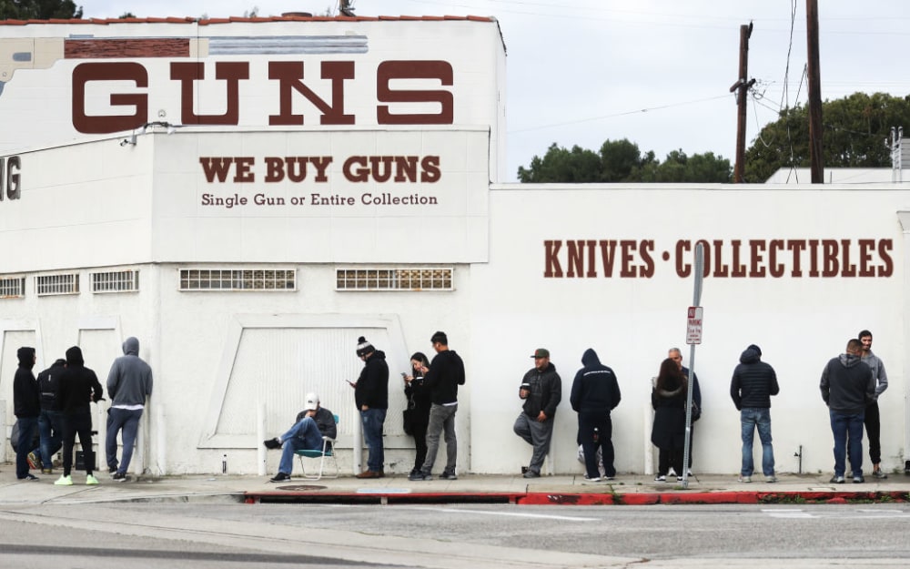CULVER CITY, CALIFORNIA - MARCH 15: People stand in line outside the Martin B. Retting, Inc. guns store on March 15, 2020 in Culver City, California. The spread of Coronavirus (COVID-19) has prompted some Americans to line up for supplies in a variety of stores. (Photo by Mario Tama/Getty Images)