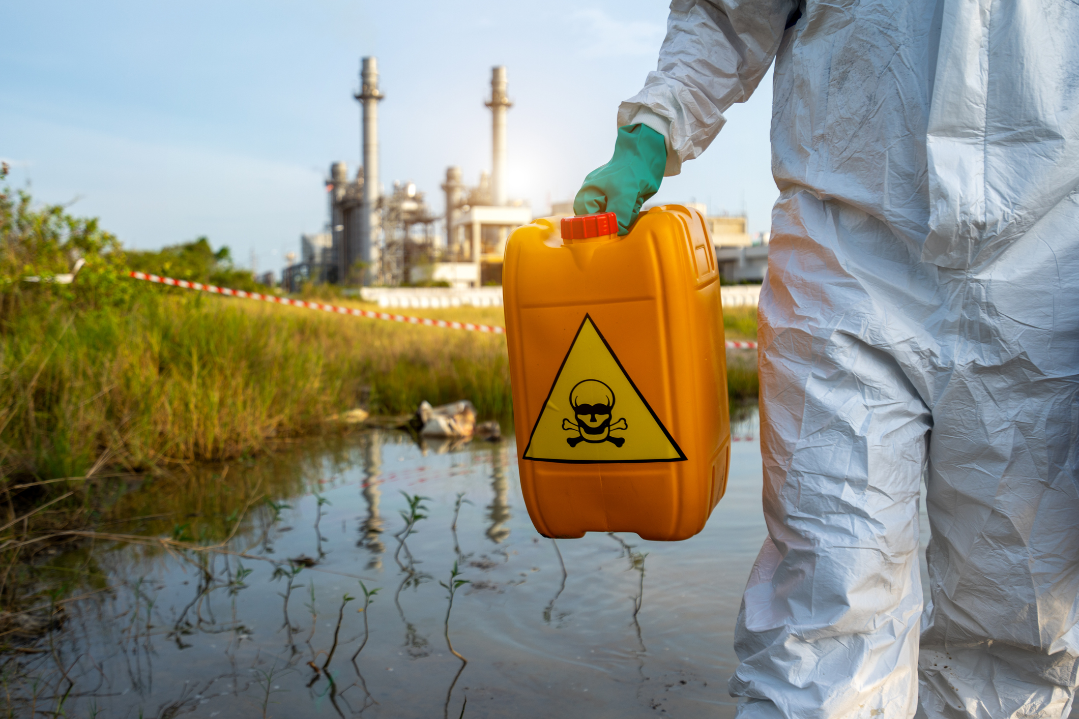 Biohazard suit with chemicals in a river