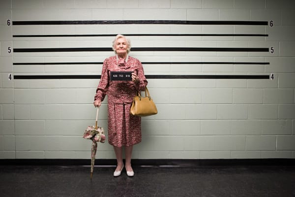 Should You Smile For a Mugshot?
