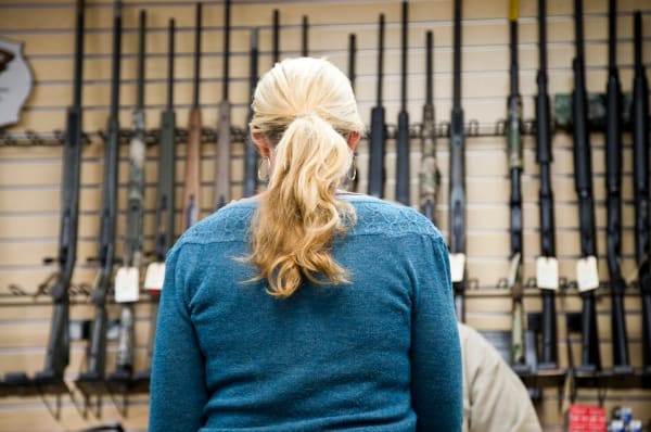 Can My Spouse Purchase or Carry a Gun for Me?